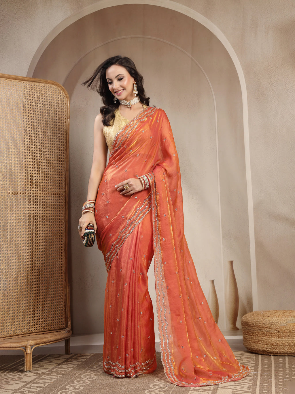 Side Pose in Rust Space Silk Saree with All Over Small Botties