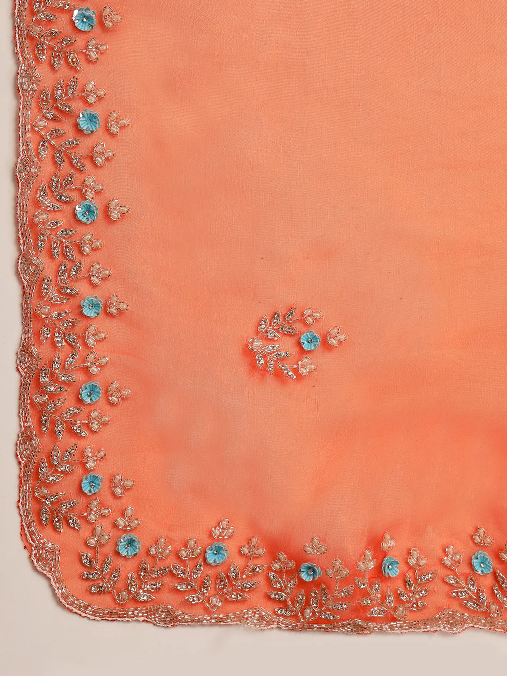 Close up of White Floral Vine Embroidery on Orange Tissue Fabric
