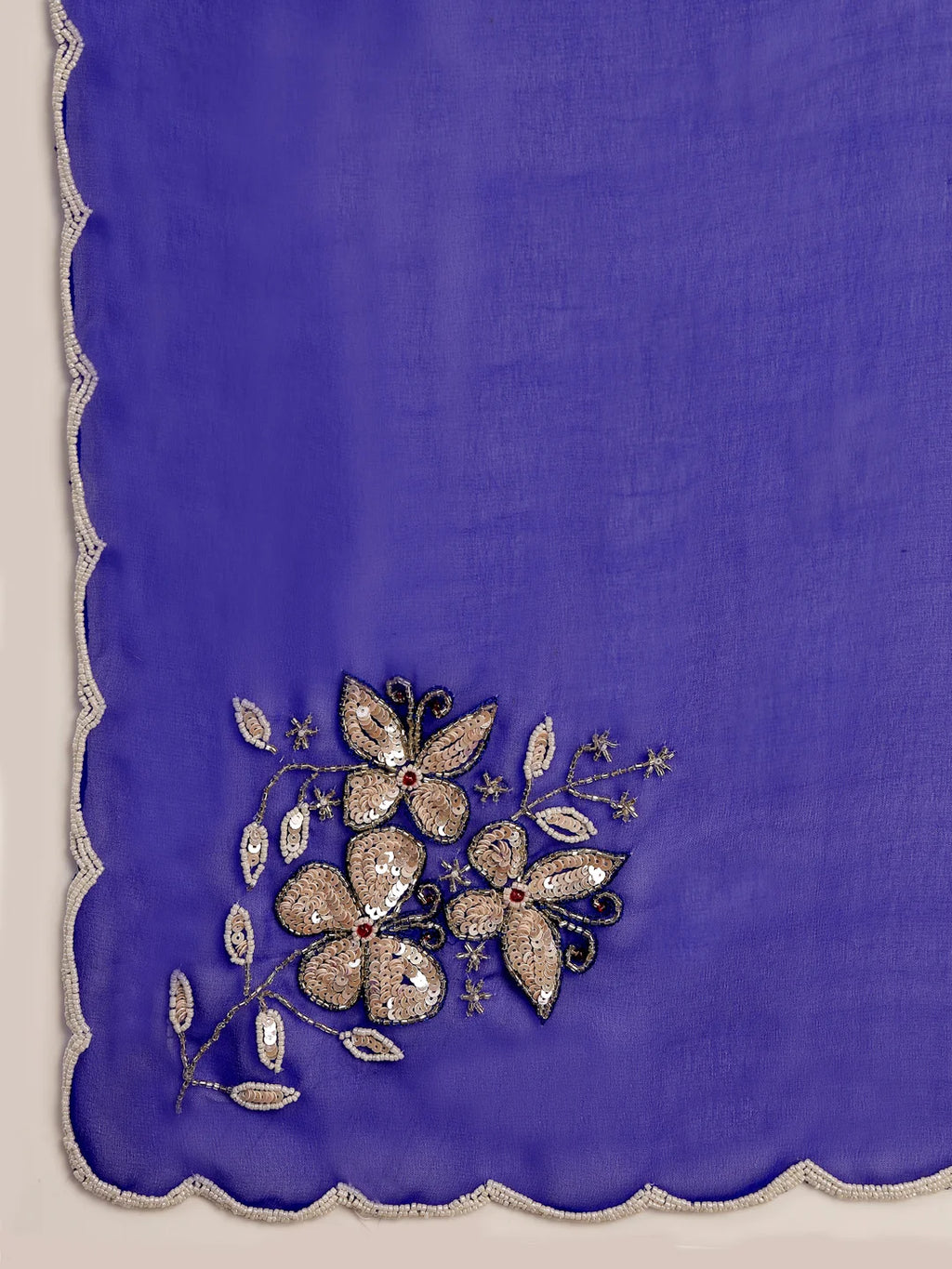 Close up of White Floral Embroidery and Scalloped Border Detail