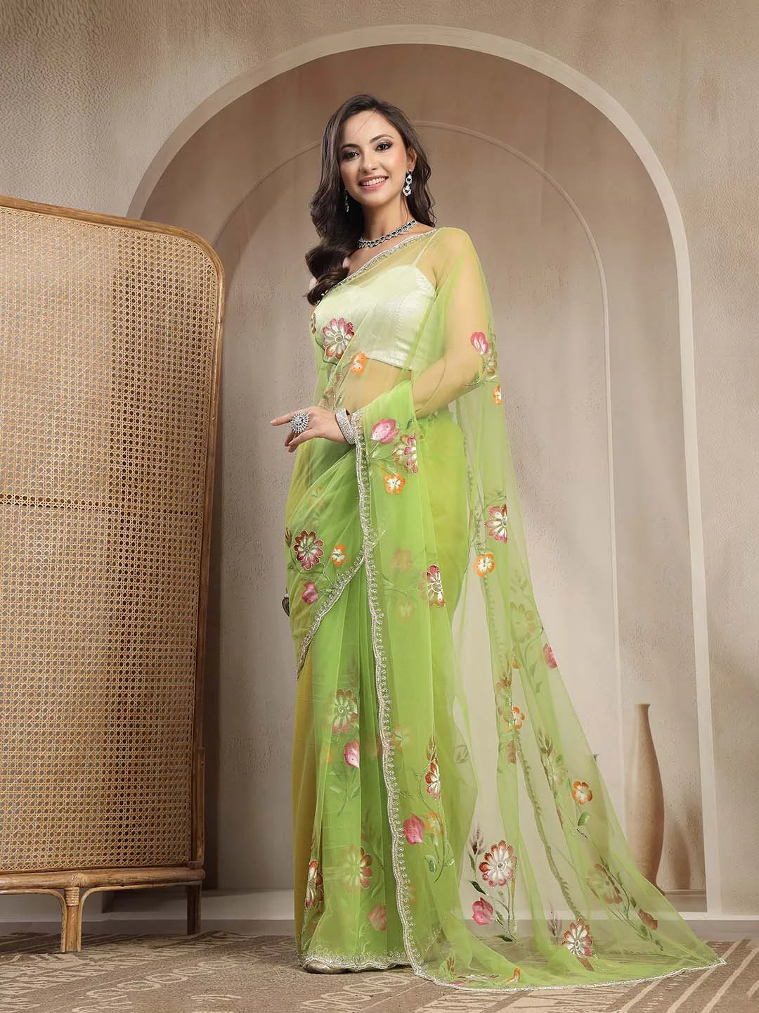 Model Sitting View in Parrot Green Floral Handpainted Net Saree