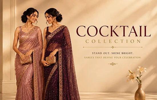 Two women modelling sarees in a warm.