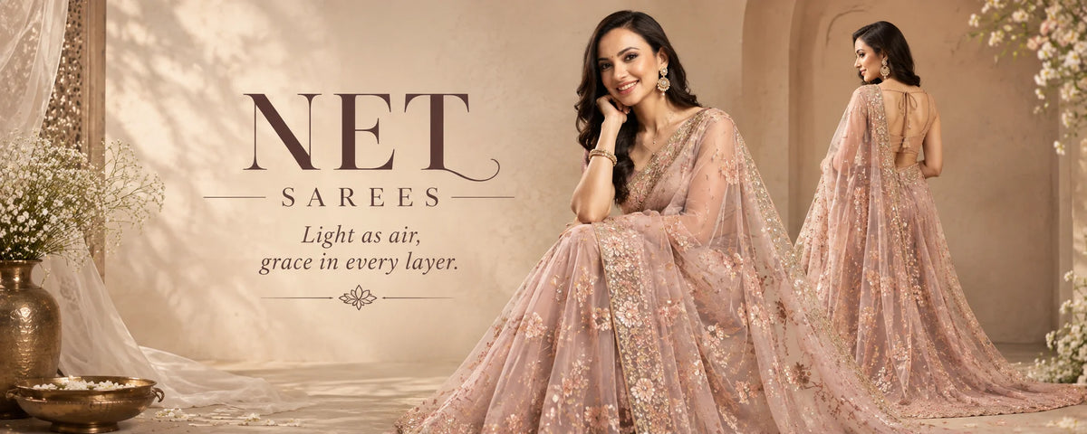 A woman modeling a light pink embroidered net saree in a warm beige studio setting, with a mirror showing the back of the gown. Large text on the left reads 'NET SAREES' with the tagline 'Light as air, grace in every layer.